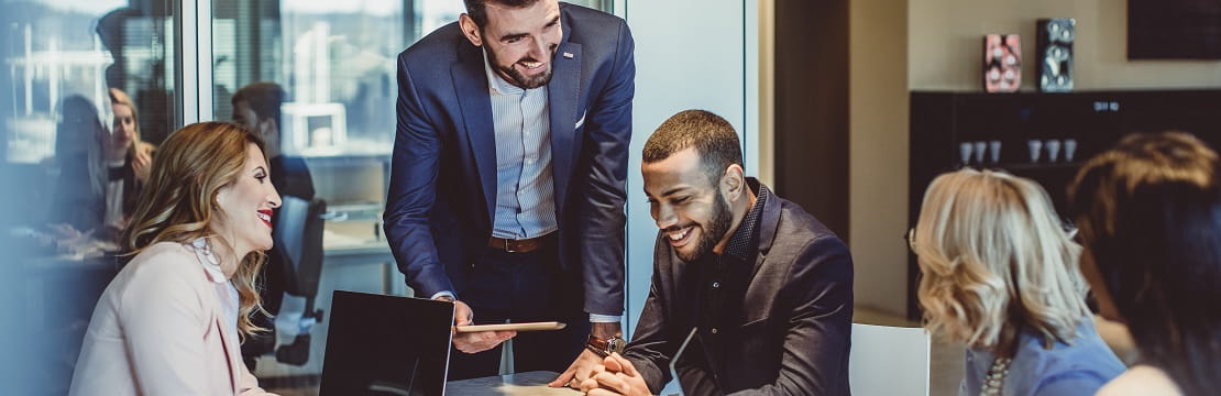 A diverse team of professionals working in a corporate office